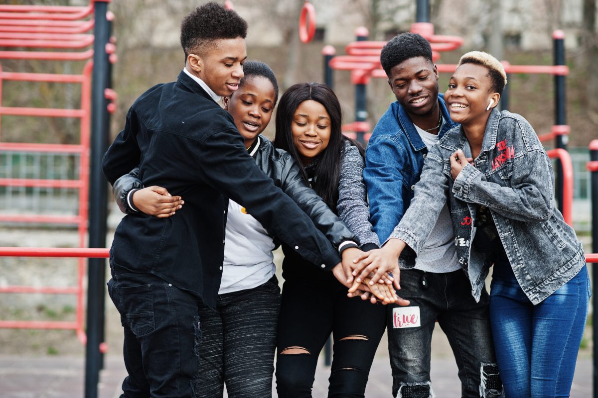 Young millennials african friends on outdoor gym. Happy black people having fun together. Generation Z friendship concept.
